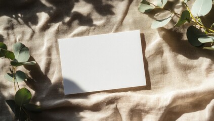 Poster - Blank card on linen fabric with eucalyptus, sun shadows