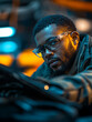 © Bohdan - Man in glasses poses confidently in a vibrant workshop