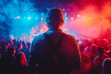 Poster - Music event with vibrant lights and crowd viewing performance from behind at night