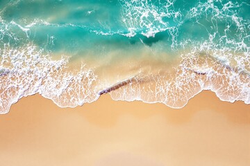 Poster - Aerial view of ocean waves crashing on sandy beach shore, creating white foam patterns.