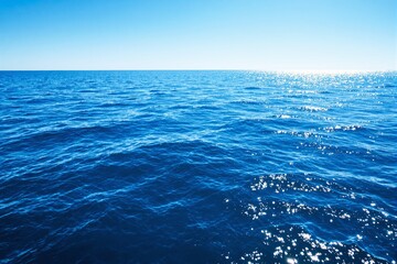 Aufkleber - Tranquil ocean water with sunlight reflections.