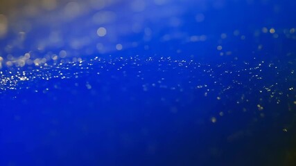 Poster - dynamic deep blue and gold gradient background with shimmering texture and radiant glow