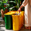© UseeIvan - Eco-friendly recycling: separating glass in colorful bins for sustainable living