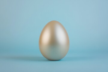 Wall Mural - A single metallic easter egg displayed on a light blue background