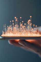 Poster - Hand holding a smartphone displaying a dynamic data visualization with glowing elements. The contemporary setting emphasizes technology's impact on daily life