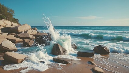 Poster - Ocean Waves Crashing Against Rocks on a Sandy Beach Under a Clear Blue Sky with Space for Text Streamlined for Creative Use