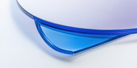 Poster - Close-up of translucent blue and white curved glass or acrylic pieces.