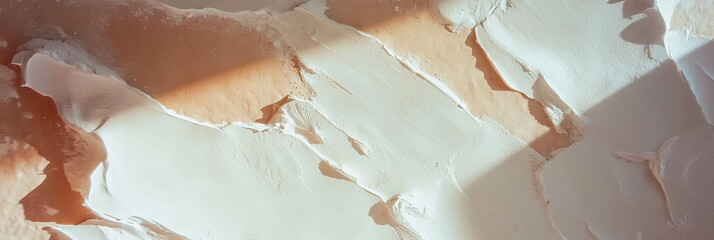 Poster - Warm beige wall texture with faded paint and gentle light shadows for background design