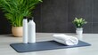 © Luba - Healthy workout setup with mat, towel, and hydration