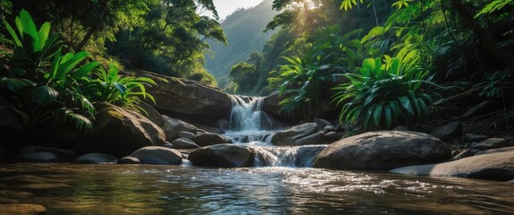 Canvas Print - Mountain stream with waterfall surrounded by lush greenery and tropical plants in a serene landscape setting. Natural beauty of wilderness.