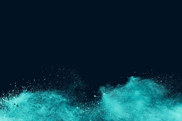 Wall Mural - abstract powder splatted background. green powder explosion on black background copy space. colored 