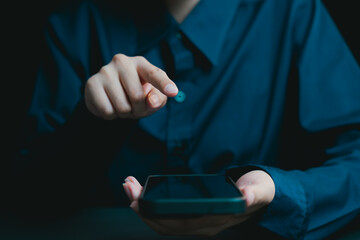 Poster - Person Using Smartphone Touchscreen in Dark Environment