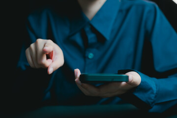 Poster - Business Professional Using Smartphone in Dark Environment