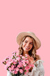 © HBS - Vertical image of a girl with flowers on a soft pink background.