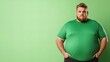 © Raul - Overweight redhead man in green shirt against a bright green background.  Serious expression.