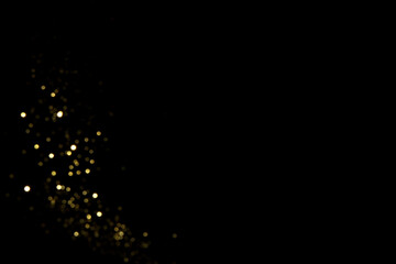 Wall Mural - golden blurred bokeh lights on black background. glitter sparkle stars for celebrate. overlay for yo