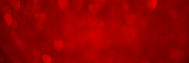 Wall Mural - Red hearts, sparkling glitter bokeh background banner, valentines day abstract defocused texture header.