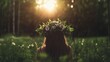 © Premium_art - Woman with flower crown in a forest at sunset. Serene, peaceful moment.
