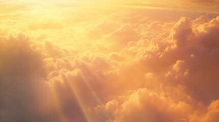 Aufkleber - A warm golden view of the clouds illuminated by sunlight, with soft light rays filtering through the clouds, symbolizing serenity, peace, and the beauty of nature.