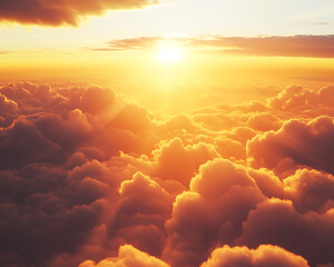 Poster - An aerial view of the golden sunrise over soft clouds, creating a tranquil and serene atmosphere, symbolizing natural beauty, peacefulness, and the dawn of a new day.