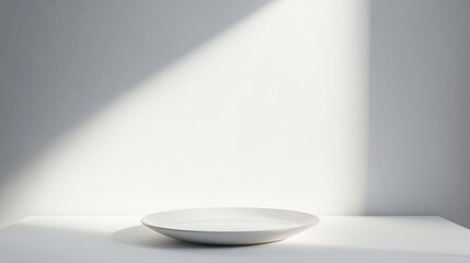 Poster - Bright Light Shines on a White Platform in a Minimalist Studio Space Creating a Dynamic Visual Contrast and Enhancing the Depth of the Scene