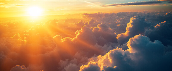 Aufkleber - Aerial view of a vibrant sunset over fluffy clouds, casting golden light across the sky, symbolizing peace, beauty, and serenity in the vast atmosphere.