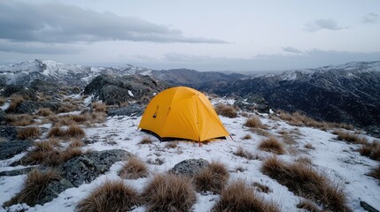 snowy mountaintop campsite with tent