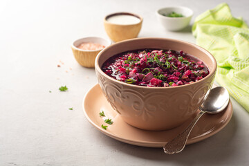 Wall Mural - Cold borscht or Holodnik or Svekolnik, traditional summer beet soup in ceramic bowl on concrete background