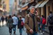 © Rick Captura - Bearded Man Conversing on Cell Phone While Walking on Street