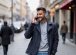 © Rick Captura - Arab Man Walking Down Street Talking on a Cell Phone