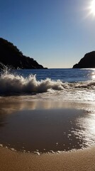 Wall Mural - Serene beach sunset with waves crashing on sandy shore