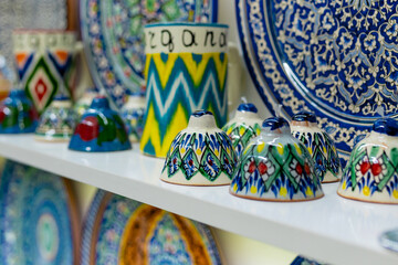 Wall Mural - Ethnic Uzbek ceramic tableware. Decorative ceramic plates and cups with traditional uzbekistan ornament.