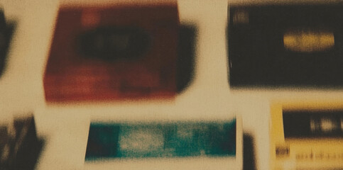 Poster - Blurry abstract background of colorful cards arranged on a light surface