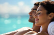 © kossovskiy - Couple relaxing luxuriously by the ocean