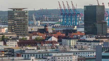 Wall Mural - Aerial skyline timelapse of Hamburg with modern office towers and residential buildings, warm evening light, cranes in cargo port and urban panorama from bunker rooftop, Germany