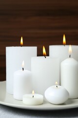 Wall Mural - Beautiful composition with candles on the table