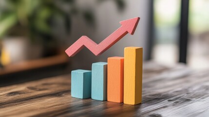 Poster - Colorful wooden blocks representing growth in a business graph on a rustic table with greenery