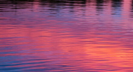 Poster - Reflections of Dusk: The surface of a calm lake shimmers with the vibrant hues of sunset, creating a mesmerizing display of color and light.