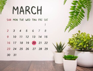 Wall Mural - Wooden block calendar with date March 20 in the hand of puppet