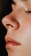 © olga_demina - Close up of a woman's nose, lips, and freckles, highlighting the concepts of rhinoplasty, cosmetology, and beauty, suggesting themes of breathing, smelling, and skincare