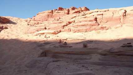 Poster - Explore Tsvetnoy Canyon in Egypt during a clear day with stunning rock formations and sandy terrain
