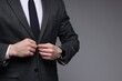 © New Africa - Man in classic suit on grey background, closeup. Space for text