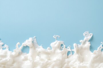 Canvas Print - White foamy liquid splash against a blue background