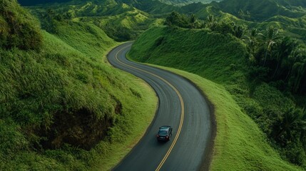 Aufkleber - Aerial view capturing a scenic route meandering through lush green hills, highlighting the breathtaking beauty of nature and the allure of the open road