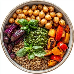 Wall Mural - Colorful Healthy Grain Bowl with Chickpeas, Roasted Vegetables, Fresh Basil, and Pesto Sauce on a Cozy Wooden Table