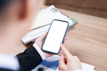 Wall Mural - top view woman sitting and holding blank screen mock up mobile phone