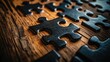 © Tyrah - Close-up of interlocking puzzle pieces on a wooden surface, highlighting intricate textures and shadows