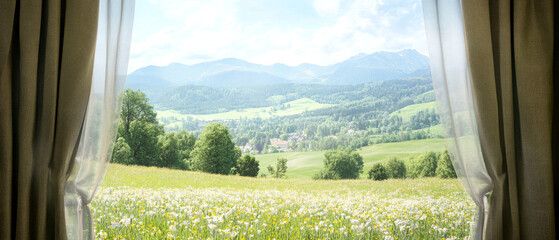 Wall Mural - Beautiful mountain view from a cozy indoor setting with flowing curtains