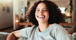 © HockleyM4/peopleimages.com - Portrait, laughing and woman in home for relax, peace and calm on weekend for comfort. Face, living room and happy female person on sofa for chill, resting and funny student with comedy in Mexico