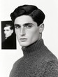 © Studio F. - Monochrome 1920s style portrait of a young man artist, facing camera wearing a woolen jumper.